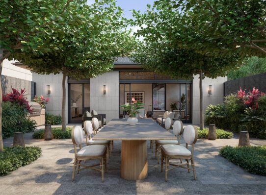 Mālie Courtyard with dining table, chairs, and grill setup for entertaining.